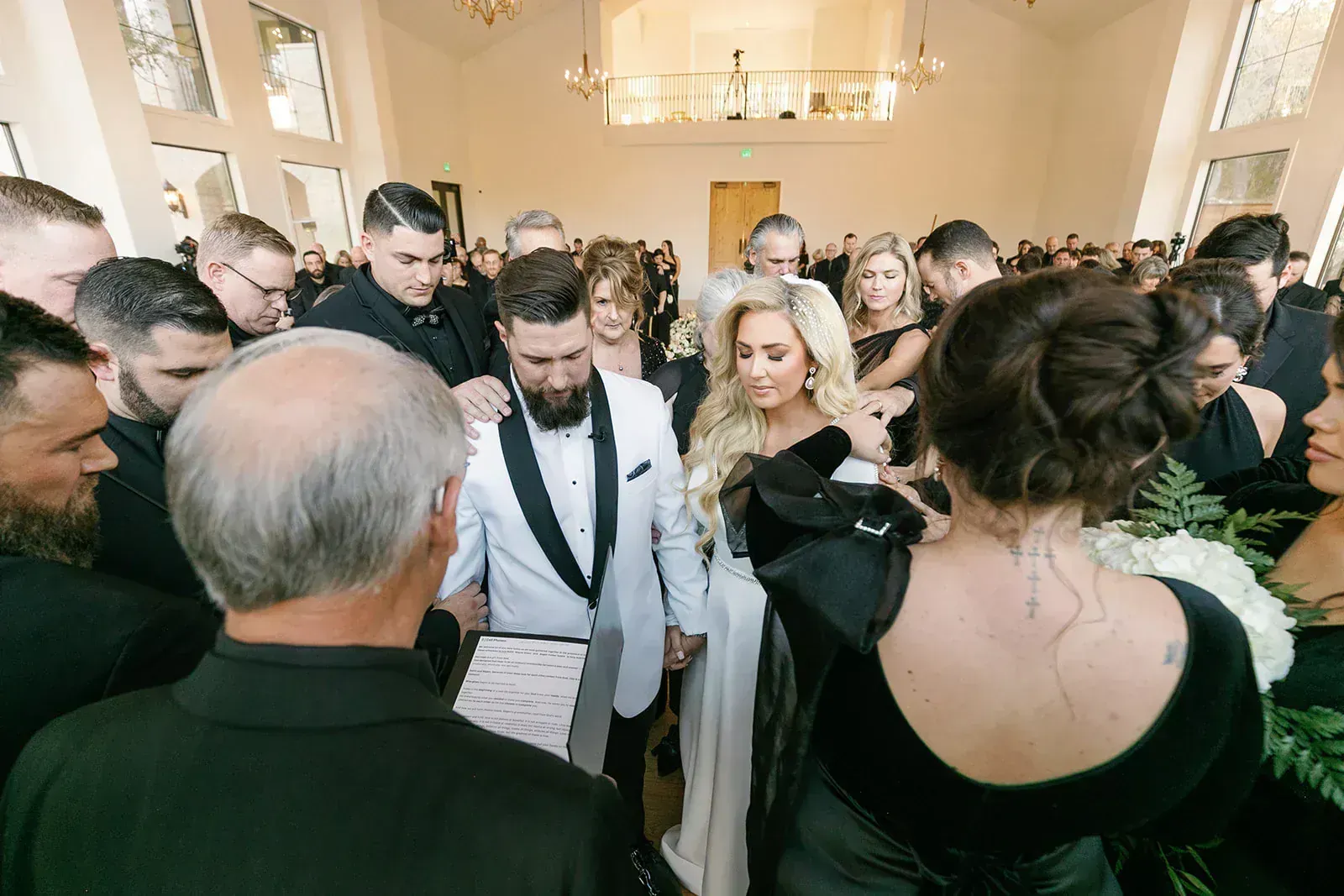 Wedding ceremony prayer moment in beautiful Texas Hill Country venue