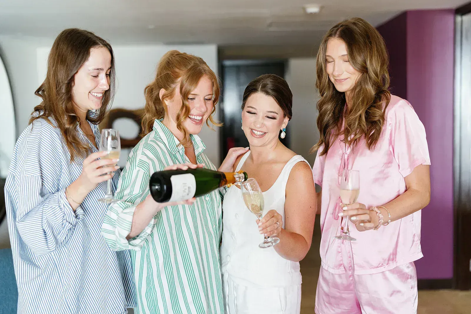 Couple walking through golden Texas Hill Country landscape