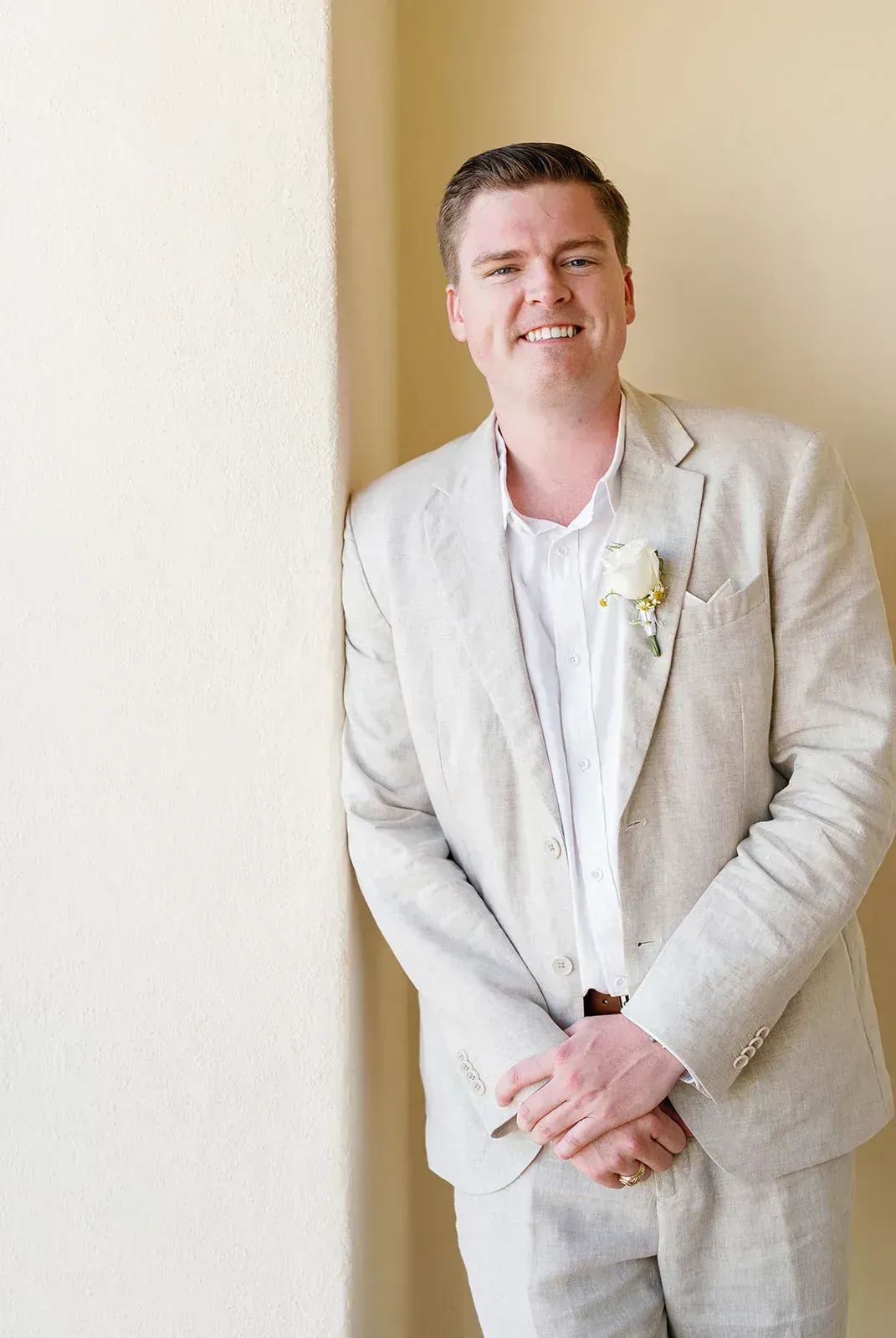 Groom portrait in linen suit at destination wedding